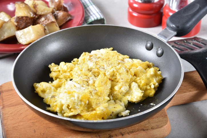 Scrambled eggs in a frying pan
