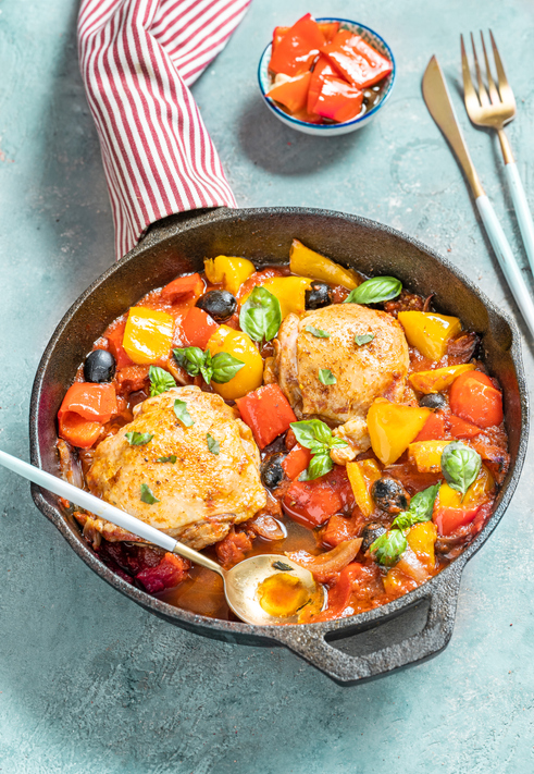 Chicken thighs with bell peppers olives tomatoes